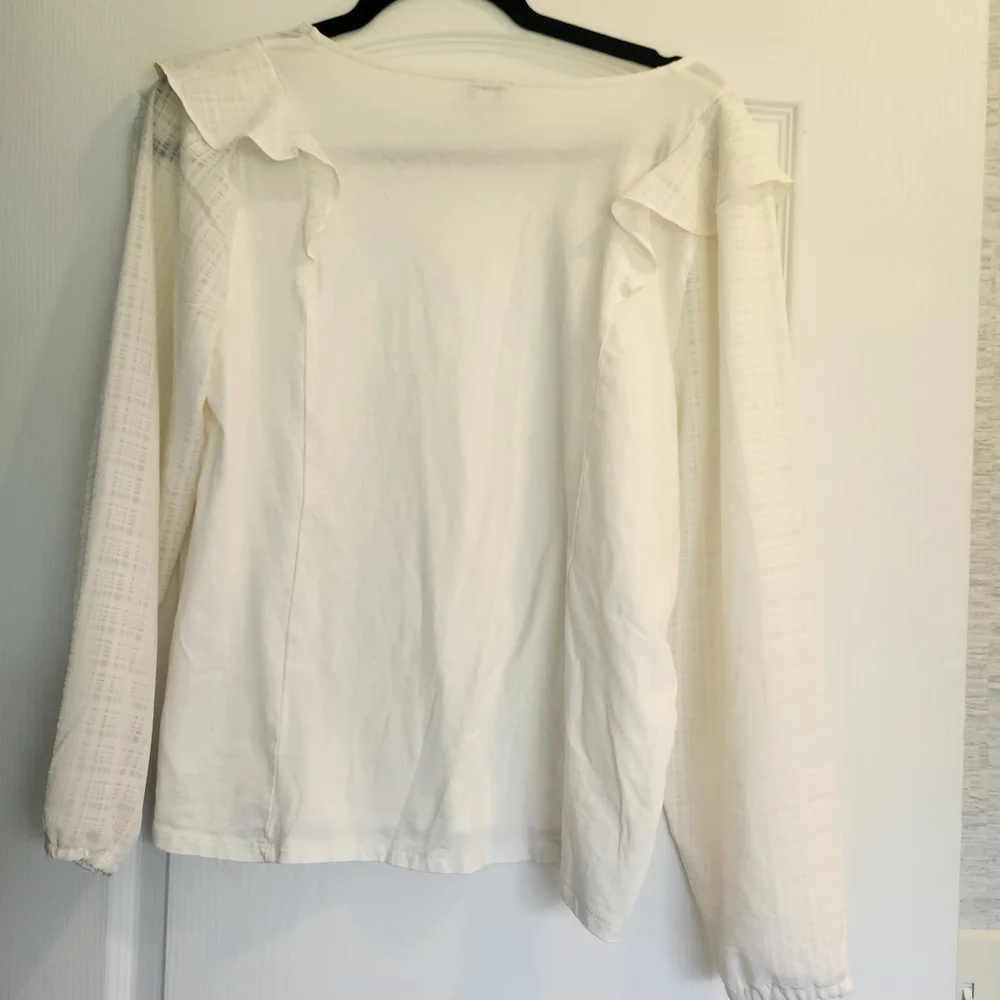 J. CREElegant White Ruffled Top